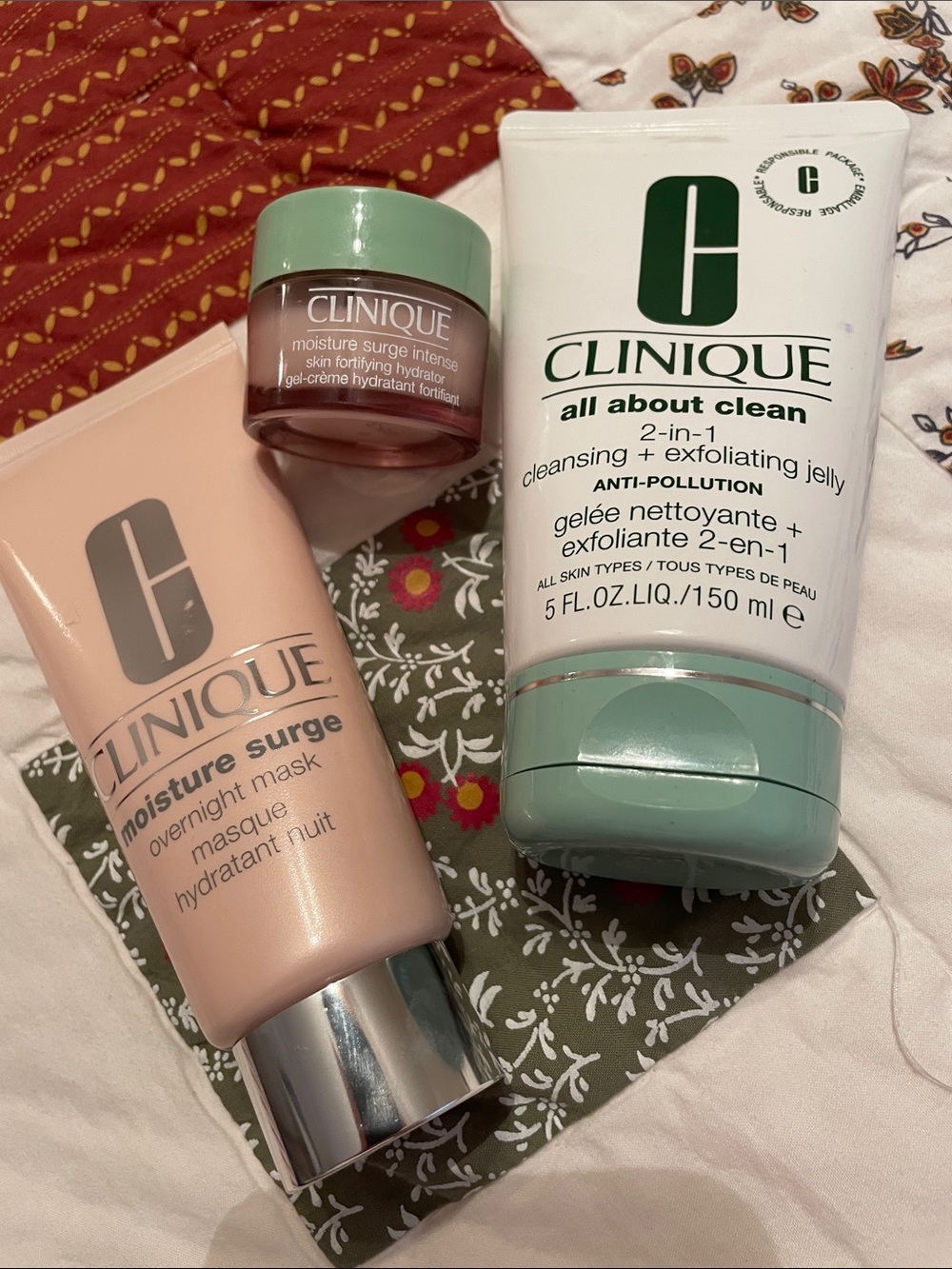 Clinique set of 3 facial products, all about clean & moisture surge plus bag